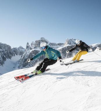 Two People Skiing