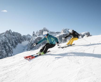 Two People Skiing