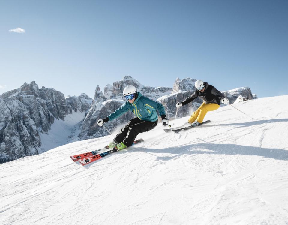 Two People Skiing