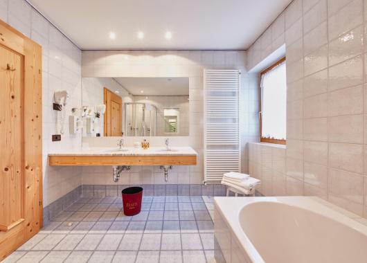 Bathroom with Bath Tub and Two Sinks