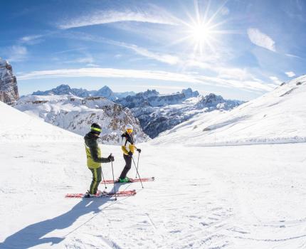 Two People Skiing