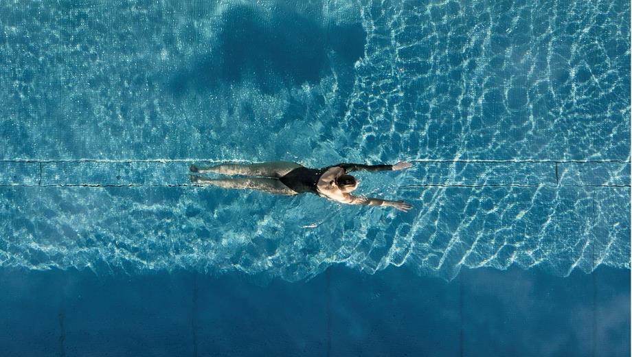 Woman swims in the Sky Pool