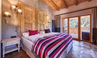 Schlafzimmer mit Terrasse - Suite Dolomites Mountain Spa