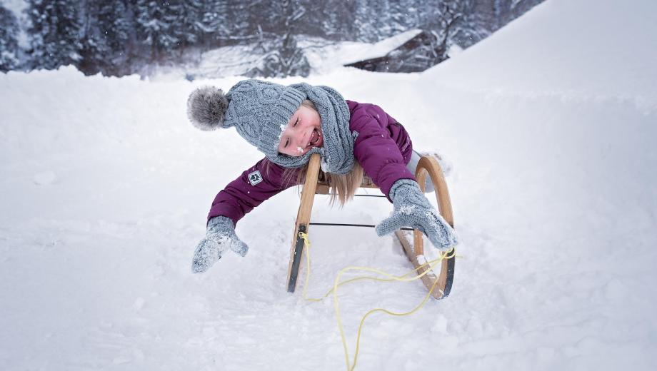 A tobogganing child